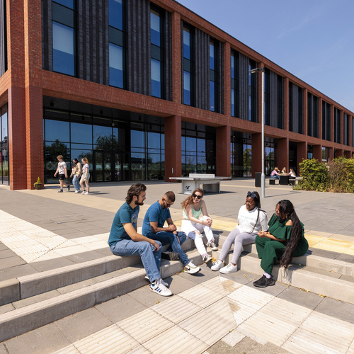 Group of students socialising outside the Catalyst Building